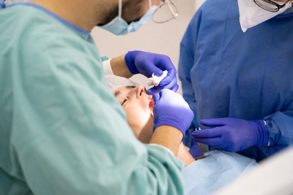 Dentist operating on a patient 