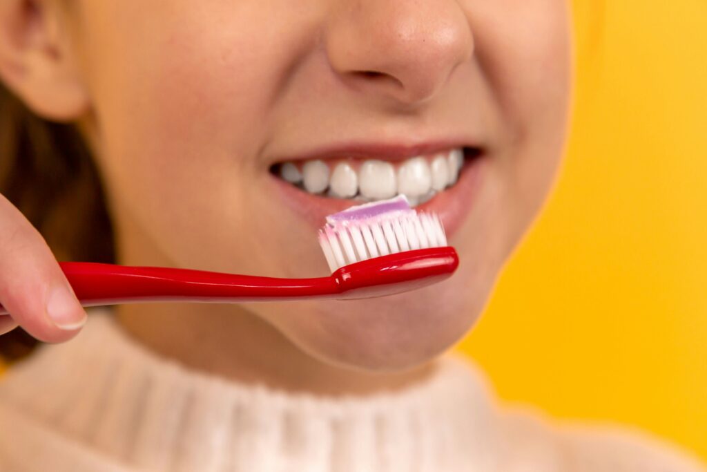 A woman brushing her teeth